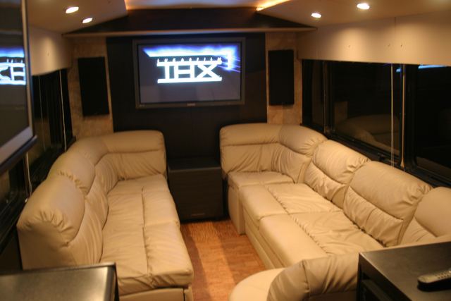 Lounge with a large screen showing the THX logo