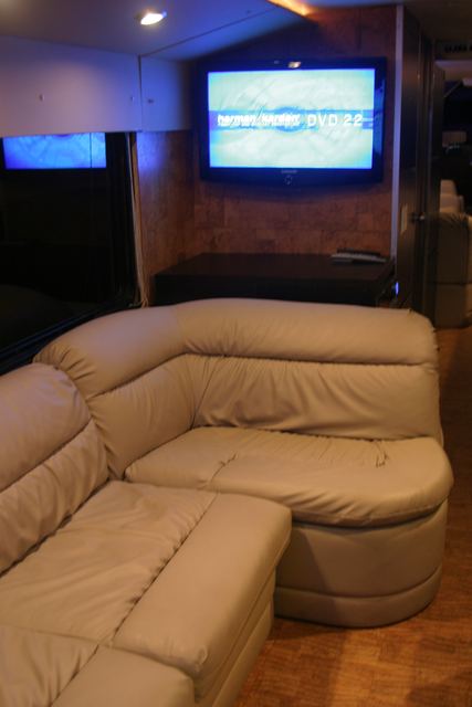 Flat panel mounted above a couch corner