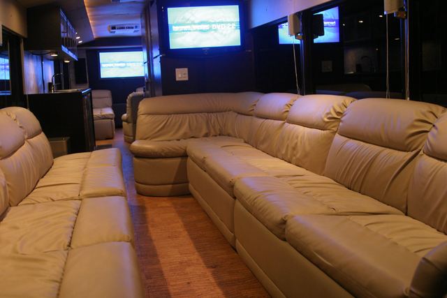 Long cream leather couch along the wall